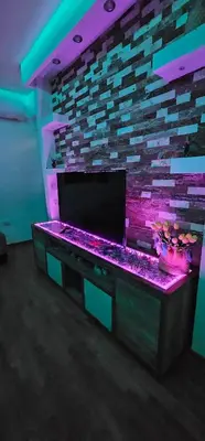 a room with a gaming table with purple lights at Vrnjački Lux free parking GARAGE in Vrnjačka Banja