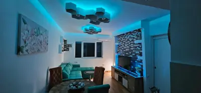 a living room with a blue light on the ceiling at Vrnjački Lux free parking GARAGE in Vrnjačka Banja