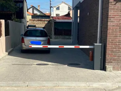 a car parked in front of a garage at Sunflower apartment in Niš