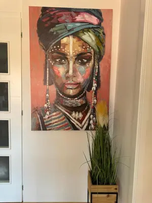 a painting of a woman with a turban at MM LUX apartment in Niš