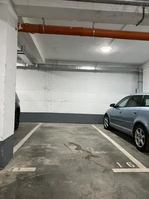 a parking garage with a car parked in it at MM LUX apartment in Niš