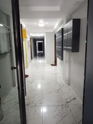 a hallway with a marble floor in a building at Apartman Nikolic in Jagodina