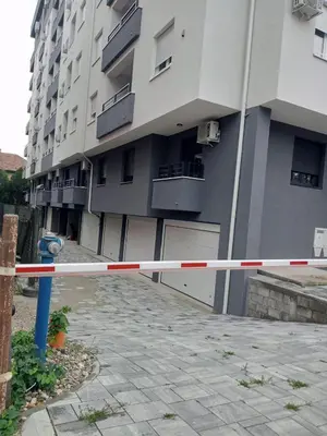 a white and red police tape in front of a building at Apartman Nikolic in Jagodina