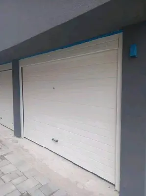 a pair of garage doors on a building at Apartman Nikolic in Jagodina