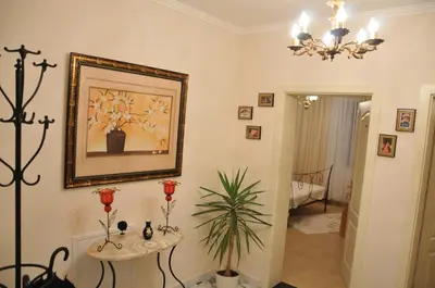 a living room with a picture on the wall at Royal Apartments in Niš