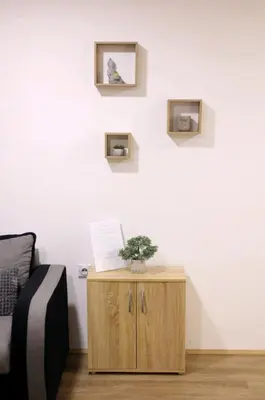 a room with a table with a laptop on a wall at Apartman Luki in Soko Banja