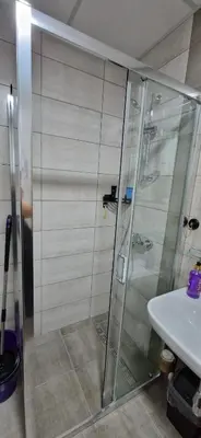 a bathroom with a shower and a sink at Aqua Park Lux Jagodina in Trnava