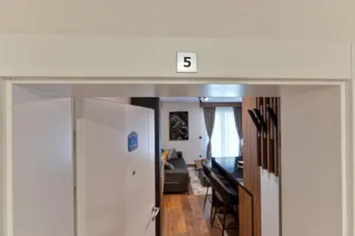 a room with the number above a door at Apartman Riva in Vrnjačka Banja