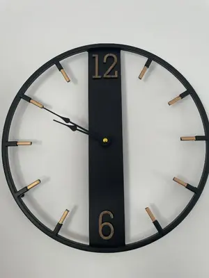 a black and white clock on a white wall at Apartman Dolce Vita Sokobanja in Soko Banja