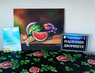 a painting of a bowl of fruit next to a sign at Domaćinsvo Stević - Sekurič in Belušić