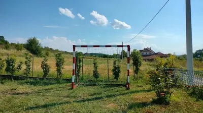 a soccer goal in the middle of a field at Domaćinsvo Stević - Sekurič in Belušić