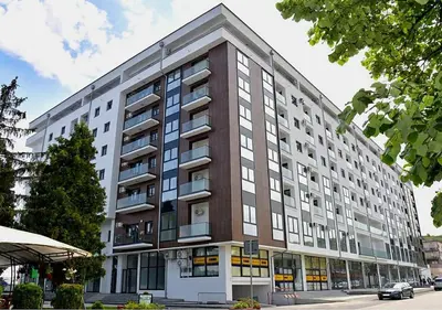 a large apartment building on a city street at Skandik Luxe Residence in Jagodina