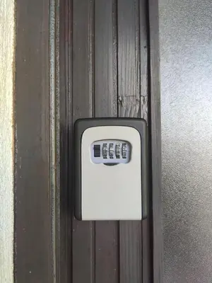 a remote control is attached to a wooden door at Park 2 Branka FREE PARKING in Vranje