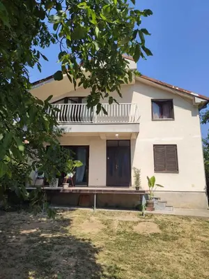 a white house with a tree in front of it at Park 2 Branka FREE PARKING in Vranje