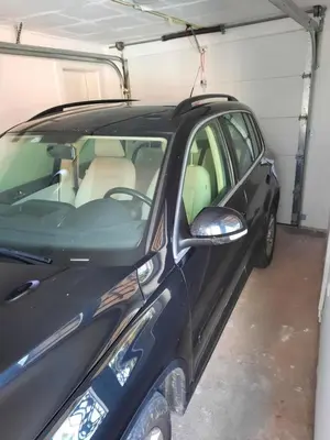 a black car parked in a garage at Dream Home, FREE GARAGE in Niš