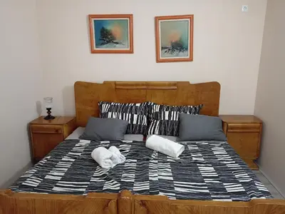 a bed with two white pillows on it at Etno Dušnik in Gadžin Han