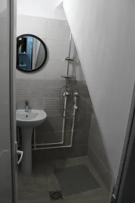 a bathroom with a sink and a mirror at Apartman Denčić Zavojsko jezero in Pirot