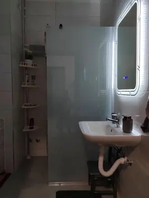 a bathroom with a sink and a mirror at Apartman Mančić in Pirot