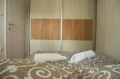 a bedroom with a bed with two pillows on it at Vasilije in Vrnjačka Banja