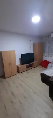 a living room with boxes and a flat screen tv at Apartman Vanja in Paraćin