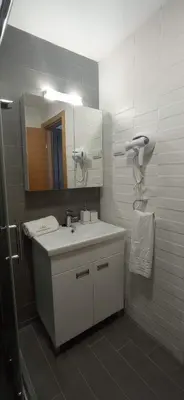 a bathroom with a sink and a mirror at Planinska idila in Kopaonik