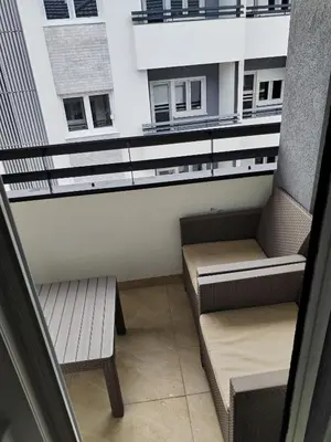 a balcony with two benches and a window at HUGO APARTMAN Green Hill Kompleks- u blizini Akva Parka in Soko Banja