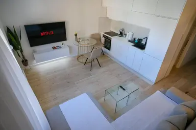 an overhead view of a living room with a couch and a tv at Apartment in Niš, Center! brand-new in Niš