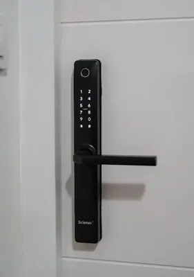 a black remote control on a white drawer at Apartment in Niš, Center! brand-new in Niš