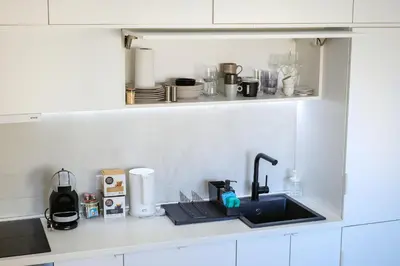 a kitchen counter top with a sink and a counter top at Apartment in Niš, Center! brand-new in Niš