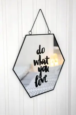 a hanging sign that says do what you live at Nilton Apartmans in Niš