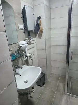 a bathroom with a sink and a mirror at Azur in Jagodina