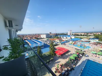 a view of a swimming pool and a beach at Azur in Jagodina
