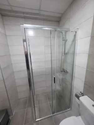 a shower with a glass door in a bathroom at Azur in Jagodina