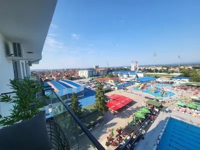 a view of a beach from a balcony of a resort at Azur in Jagodina