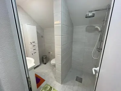 a bathroom with a shower and a toilet at Apartman La Vista Sokobanja in Soko Banja