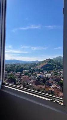 a view of a city from a window at Apartman Centar in Pirot