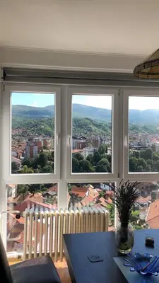 a large window with a view of a city at Apartman Centar in Pirot