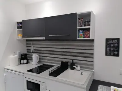 a kitchen with a sink and a counter top at DIV Bor in Bor