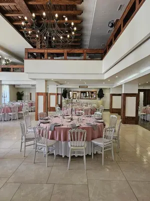 a large banquet hall with a long table and chairs at Hotel Koliba na Grza in Kilsura