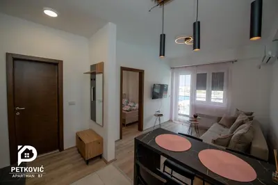 a living room with a couch and a table at Petković apartmani 87 in Jagodina