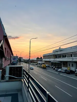 a view of a street with cars on the road at NOMAD Apartments in Niš