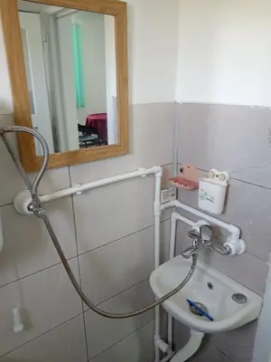 a bathroom with a sink and a mirror at Apartman Sunce in Pirot