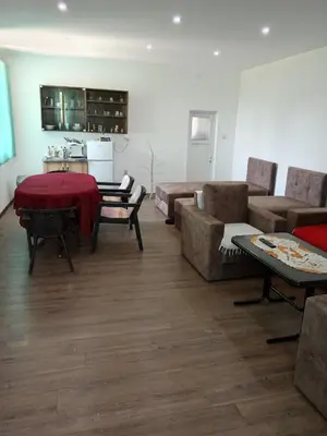 a living room with a couch and a table at Apartman Sunce in Pirot