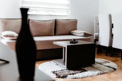 a living room with a couch and a table at Apartman Ksenija in Vrnjačka Banja
