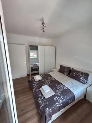 a bedroom with a large bed in a room at Soko apartments in Jagodina