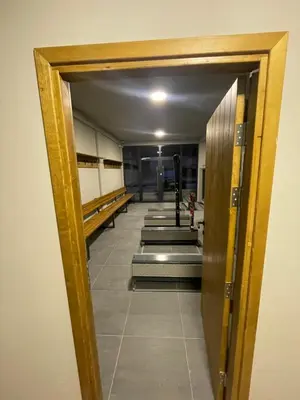 a hallway in a building with a door open at Bela Reka C320 Kopaonik Brzece in Brzeće