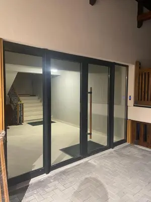 a room with sliding glass doors in a house at Bela Reka C320 Kopaonik Brzece in Brzeće