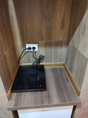 a small table with a laptop on top of it at PANORAMA SPA apartman in Kraljevo
