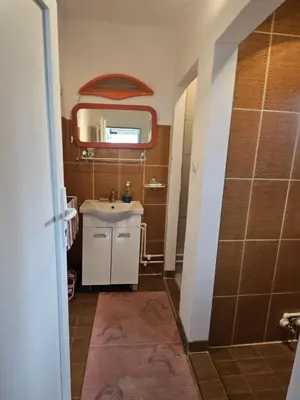 a bathroom with a sink and a mirror at VILA MILA SOKOBANJA in Soko Banja