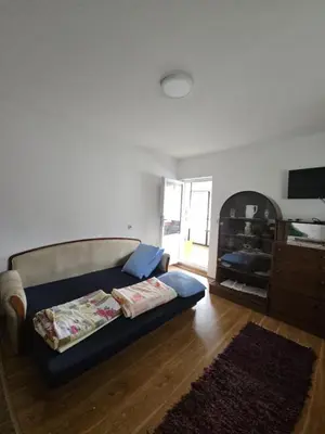 a living room with a couch and a table at VILA MILA SOKOBANJA in Soko Banja
